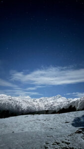 Silver mountains under moon